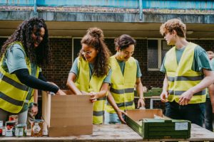 volunteers helping package food